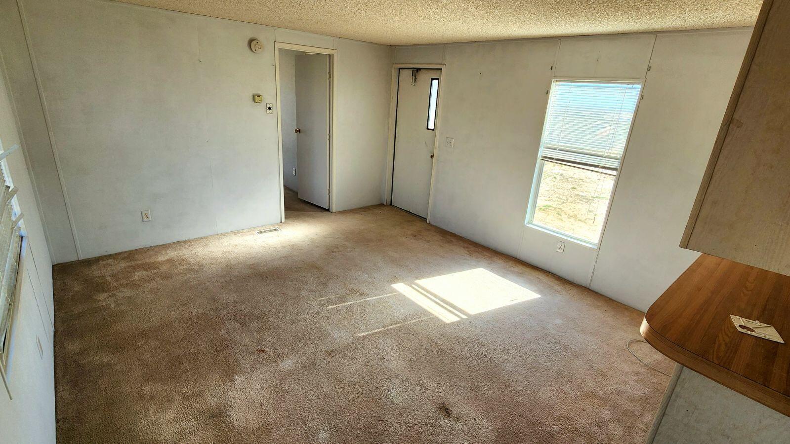 3641 Dawn Road Rosamond, CA 93560 - Photo 27 of 33 a view of empty room with windows