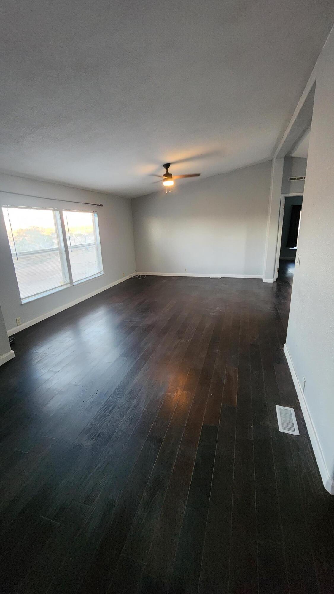 3641 Dawn Road Rosamond, CA 93560 - Photo 4 of 33 wooden floor in an empty room with a window