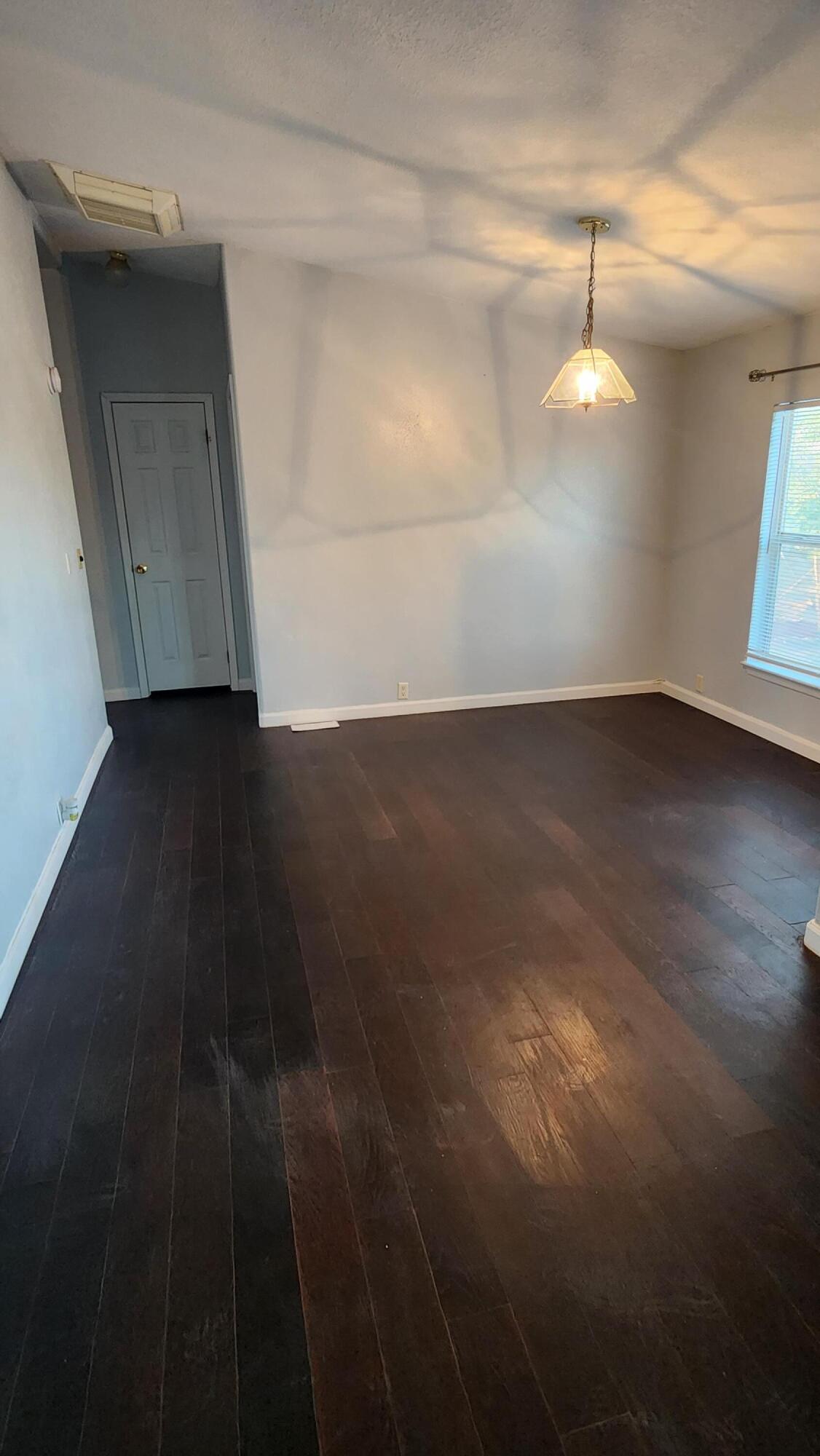 3641 Dawn Road Rosamond, CA 93560 - Photo 10 of 33 a view of empty room with wooden floor and fan