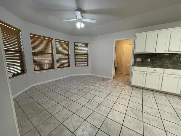 a large kitchen with a stove a sink dishwasher and a refrigerator