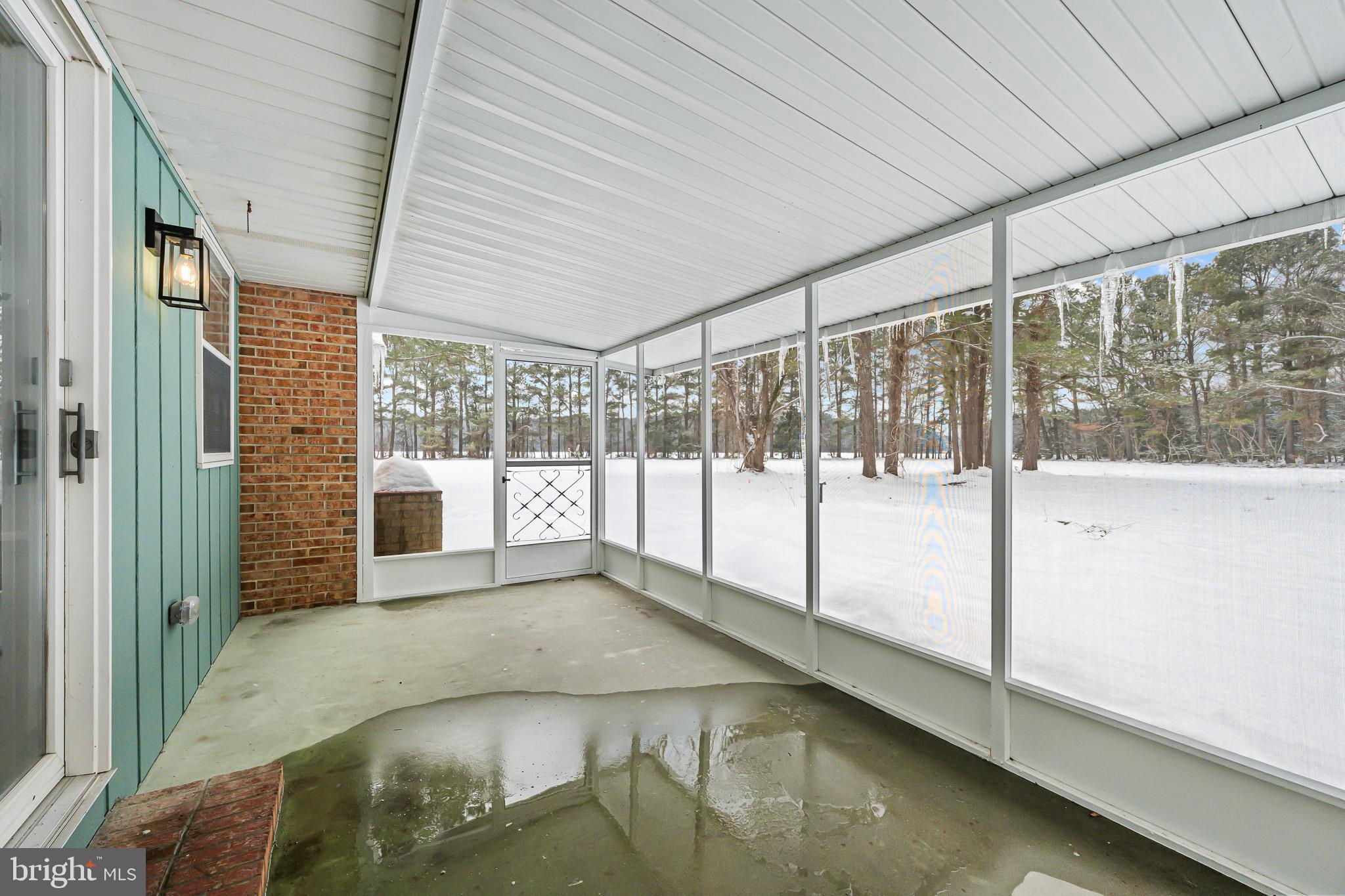 21830 Vaughn Road Georgetown, DE 19947 - Photo 20 of 39 a view of an empty room with a balcony