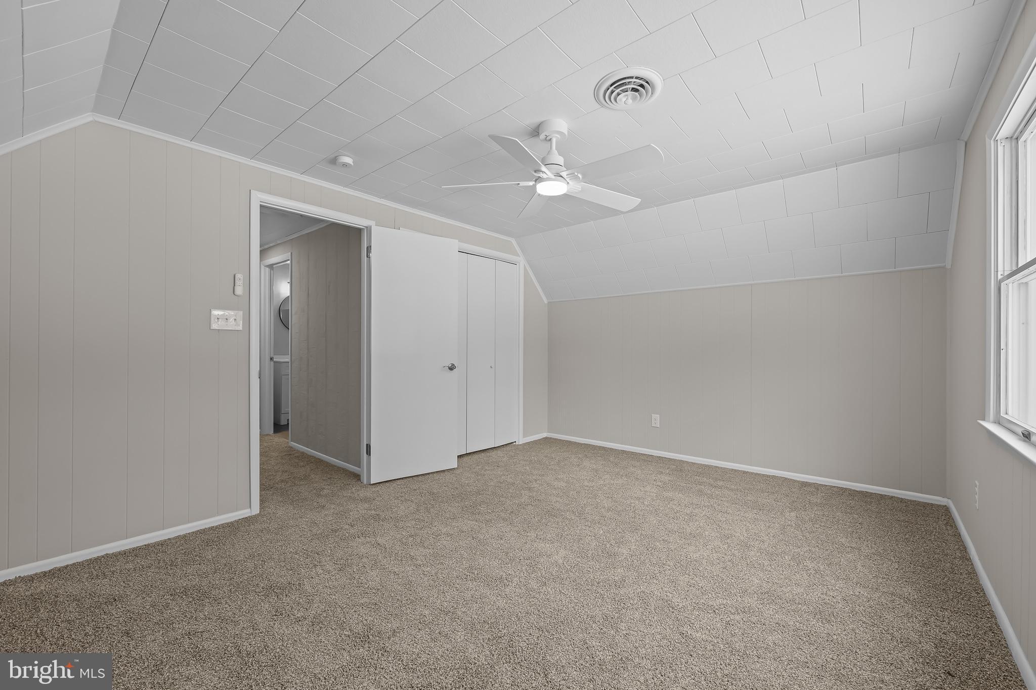 21830 Vaughn Road Georgetown, DE 19947 - Photo 22 of 39 an empty room with a ceiling fan and a window