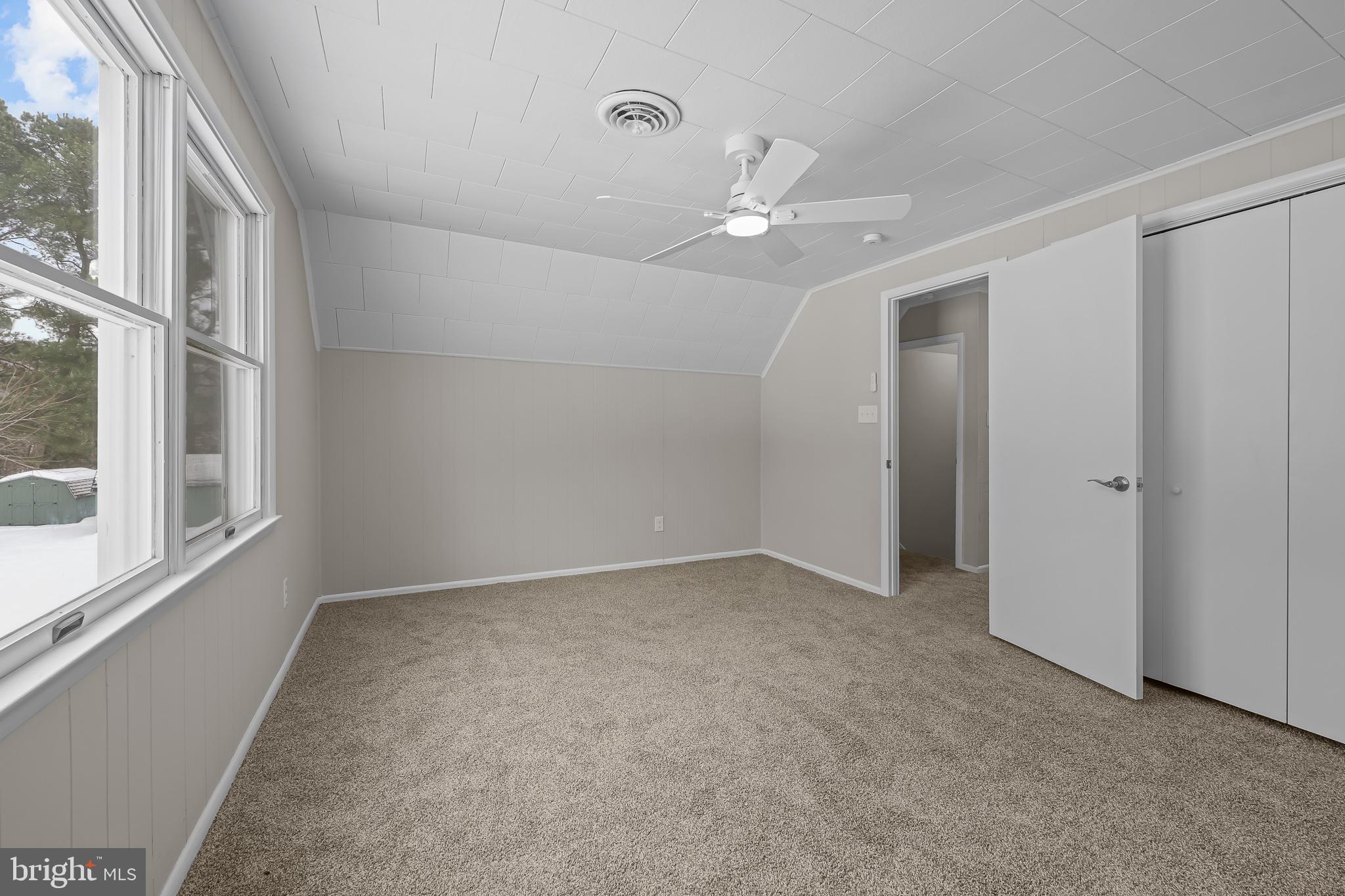 21830 Vaughn Road Georgetown, DE 19947 - Photo 23 of 39 wooden floor in an empty room with a window
