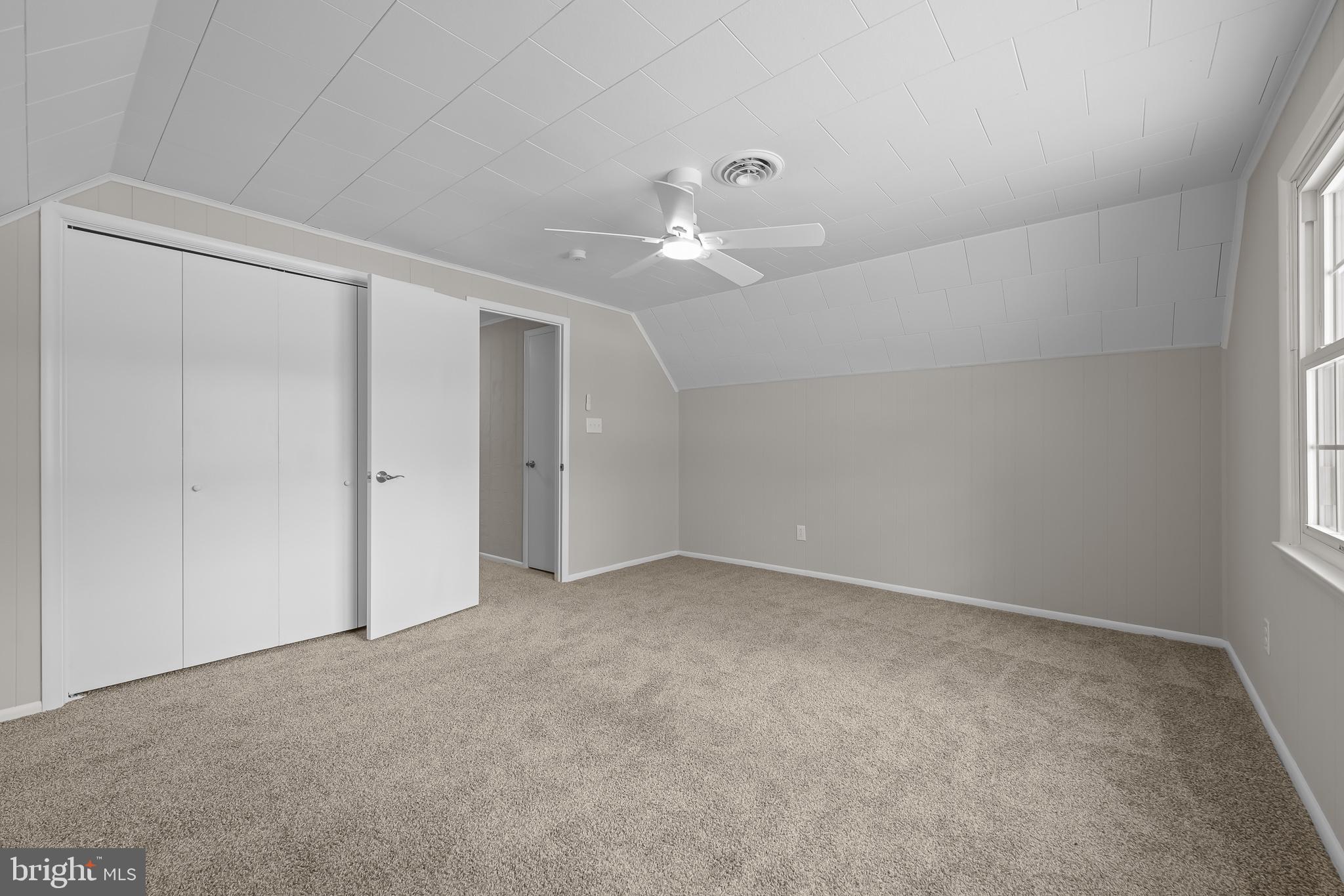 21830 Vaughn Road Georgetown, DE 19947 - Photo 25 of 39 an empty room with a ceiling fan and a window