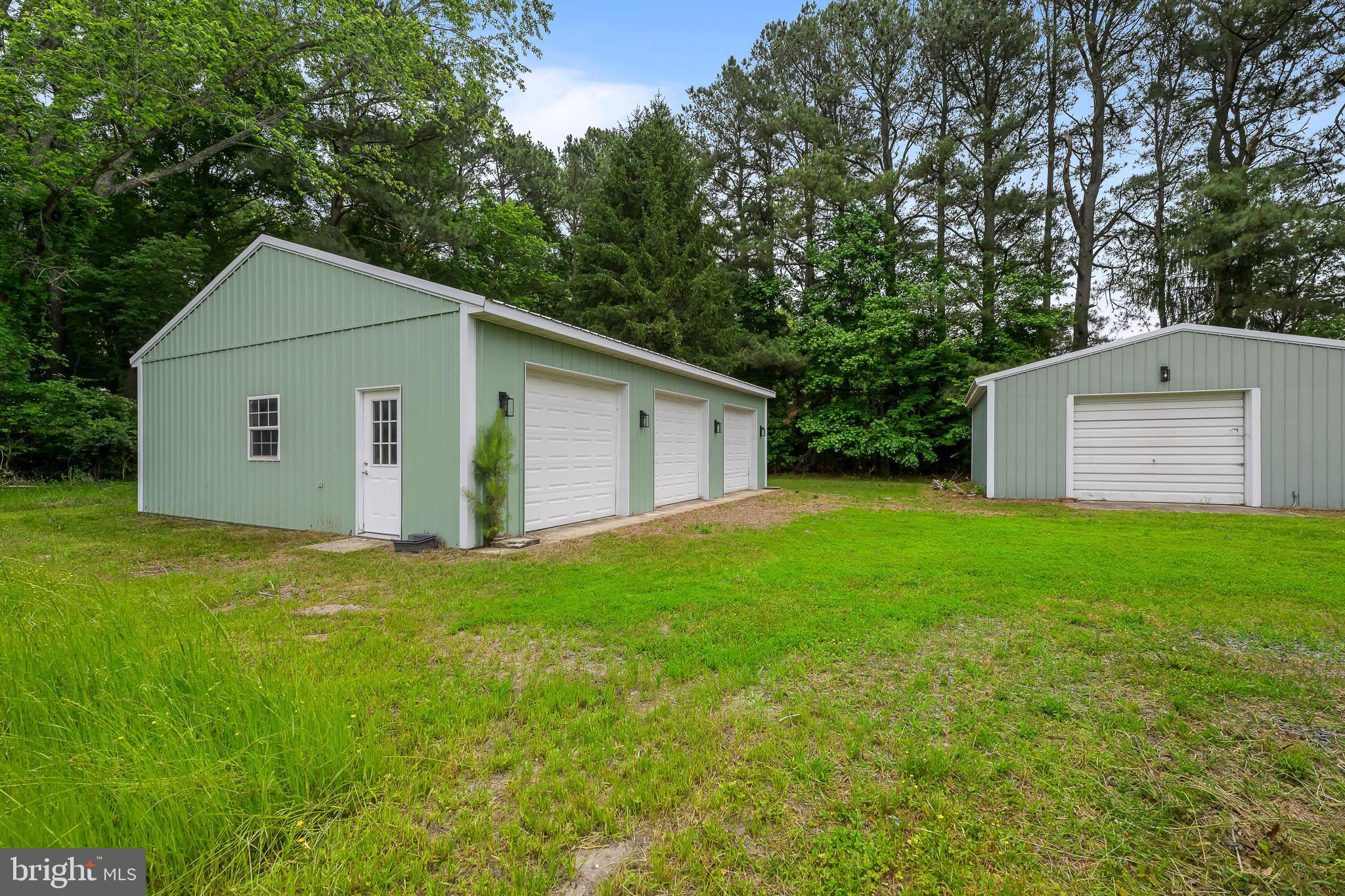 21830 Vaughn Road Georgetown, DE 19947 - Photo 32 of 39 a view of a backyard with a garden