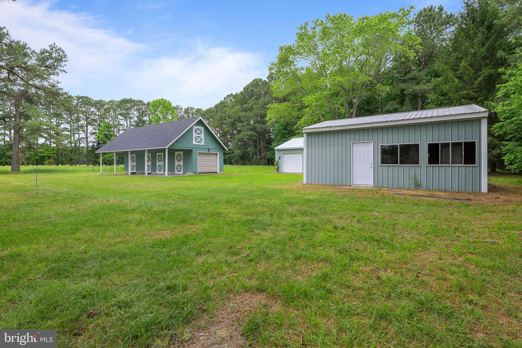 21830 Vaughn Road Georgetown, DE 19947 - Photo 33 of 39 a house view with a garden space