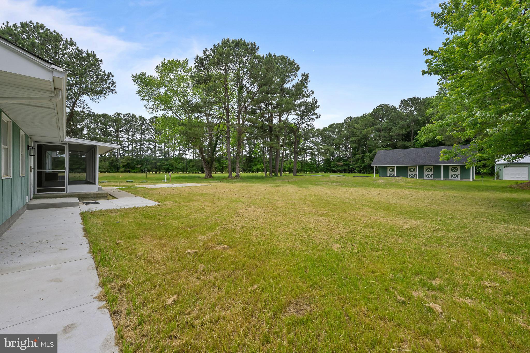 21830 Vaughn Road Georgetown, DE 19947 - Photo 34 of 39 a view of a house with a yard