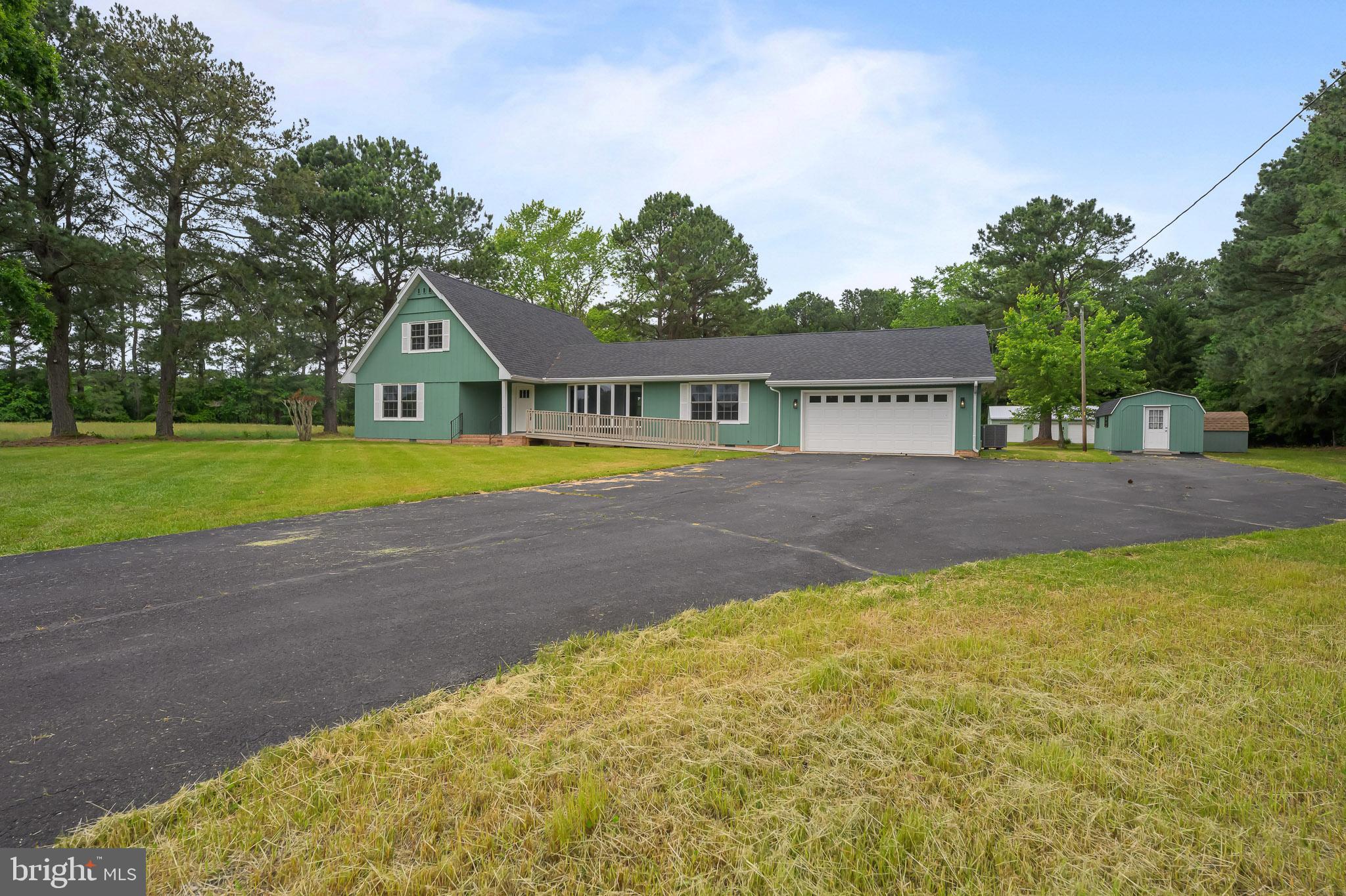 21830 Vaughn Road Georgetown, DE 19947 - Photo 39 of 39 a front view of a house with a yard and trees