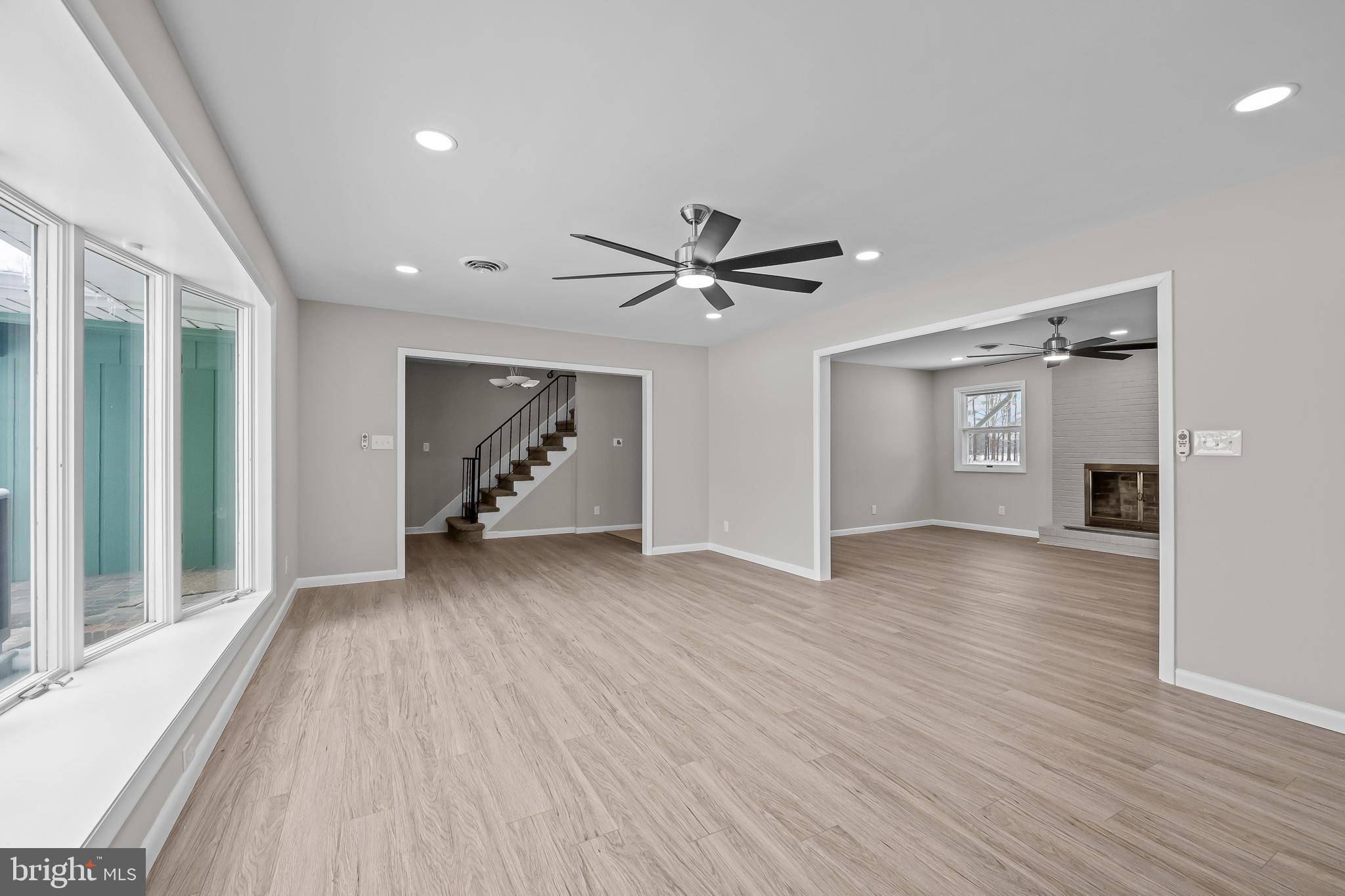 21830 Vaughn Road Georgetown, DE 19947 - Photo 7 of 39 a view of an empty room with wooden floor and a window