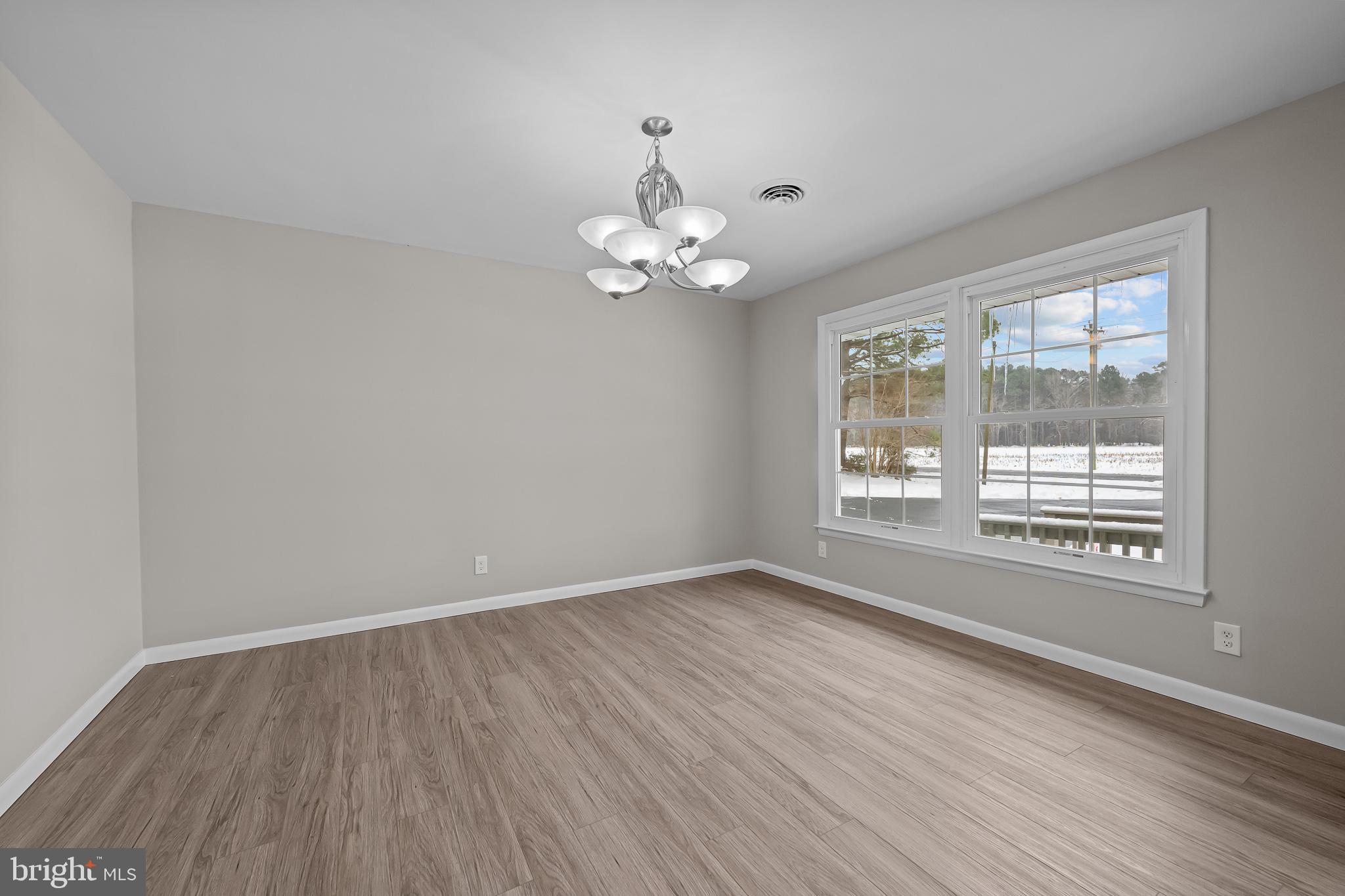 21830 Vaughn Road Georgetown, DE 19947 - Photo 10 of 39 a view of an empty room with a window