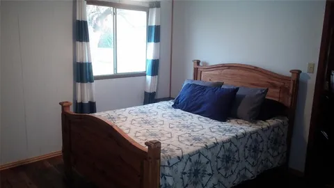 a backyard of a house with lots of green space and plants