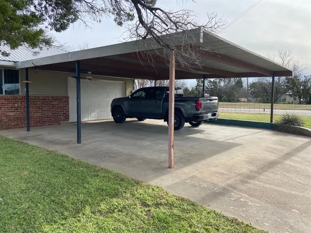 a kitchen with a sink cabinets and wooden floor