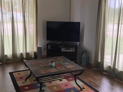 a bathroom with a sink a toilet and bathtub