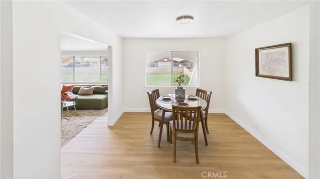 a view of a livingroom with furniture and a window