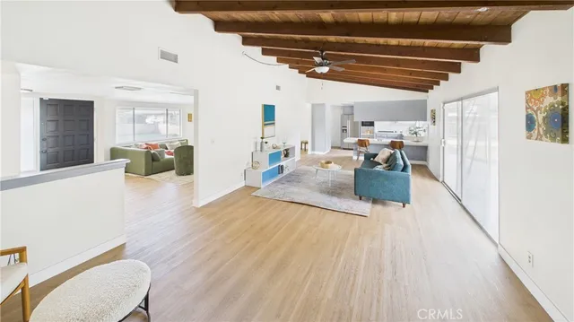 a view of a living room and dining room