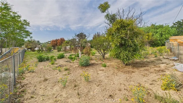 a view of lawn chairs under an umbrella