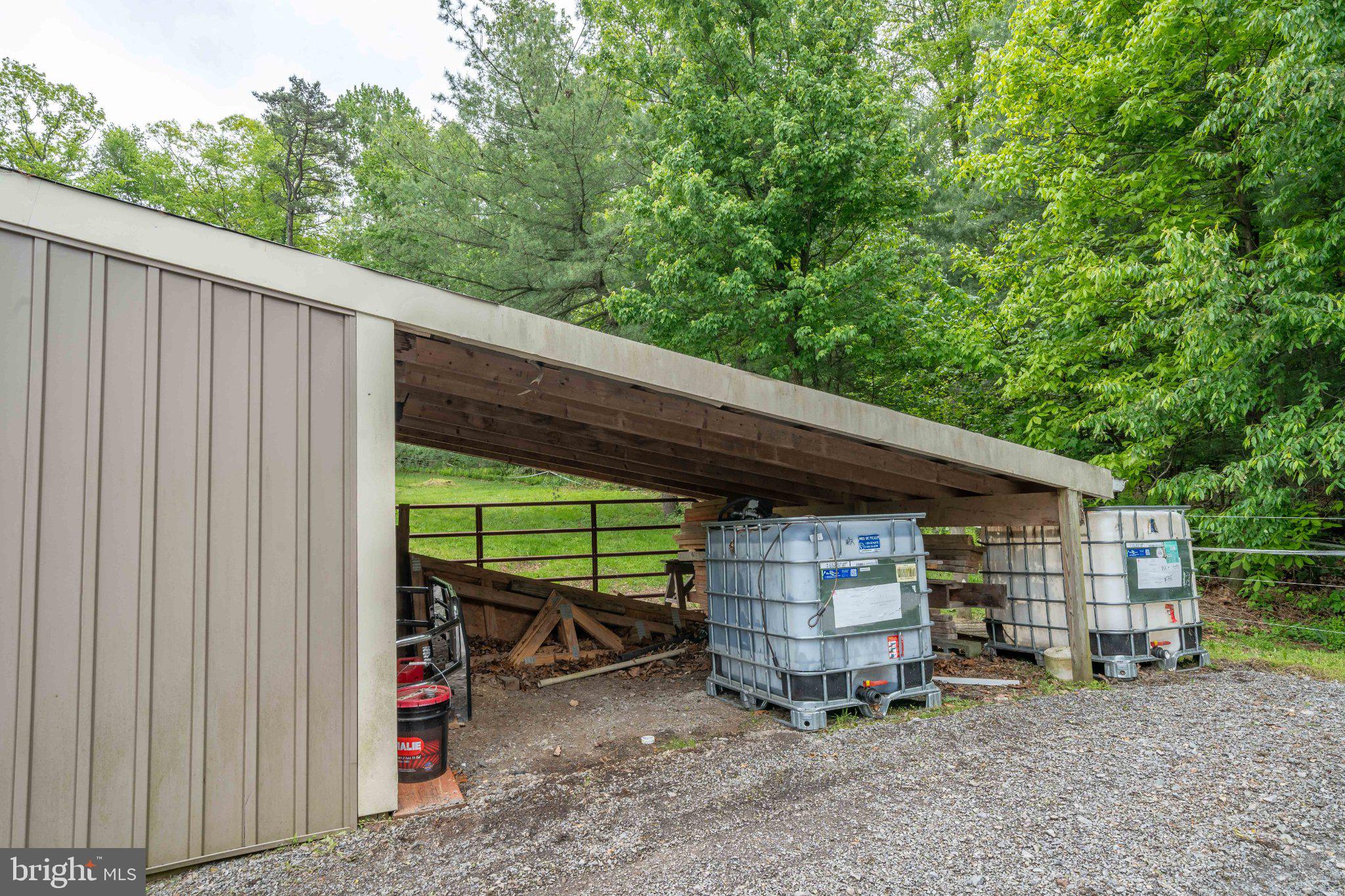 2201 Blain Road Loysville, PA 17047 - Photo 84 of 89 Sheltered storage amidst lush greenery.