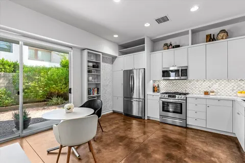 a view of a bathroom with a sink and a mirror