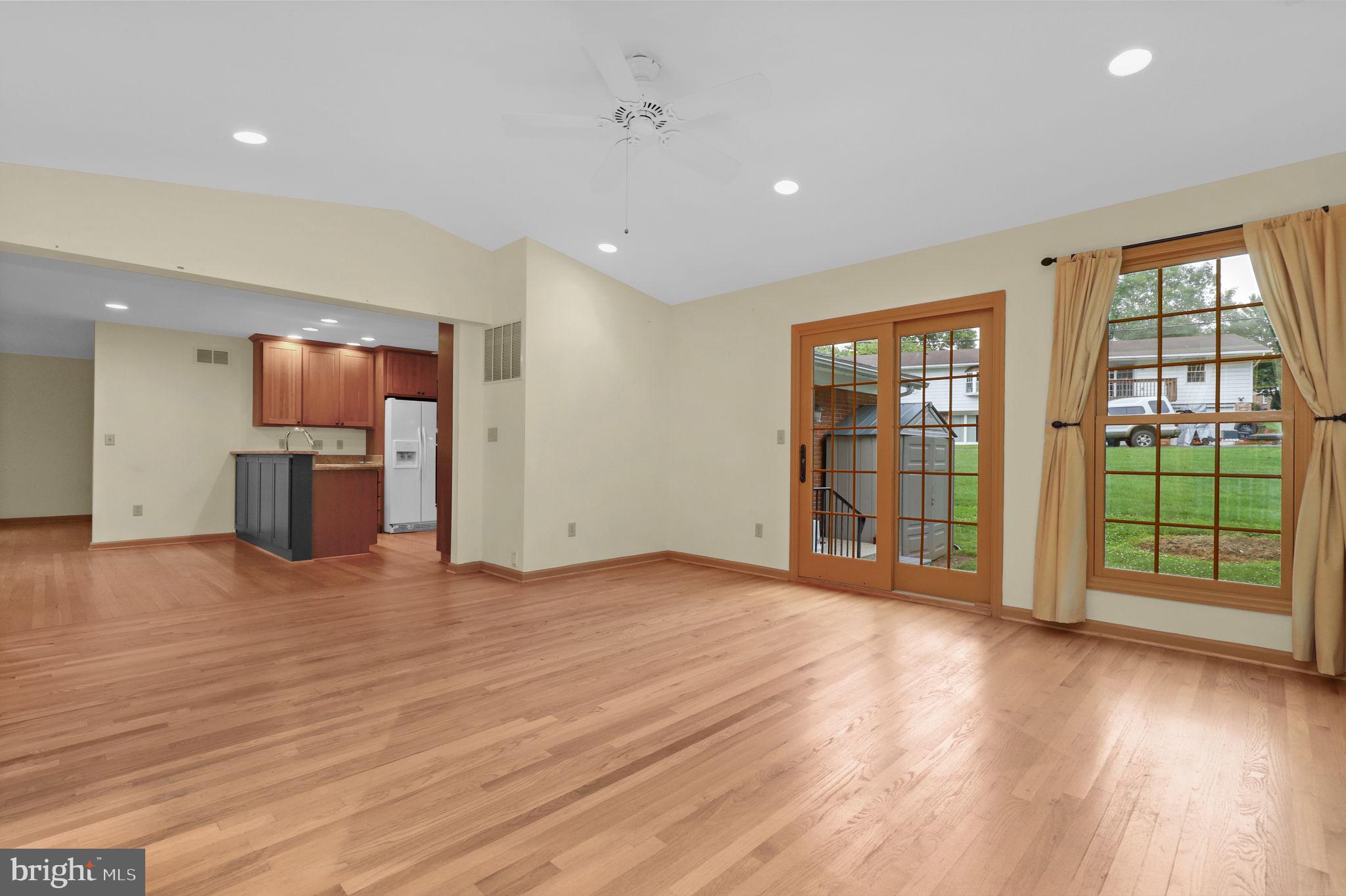 110 Linden Boulevard Middletown, MD 21769 - Photo 11 of 38 a view of an empty room with a window and wooden floor