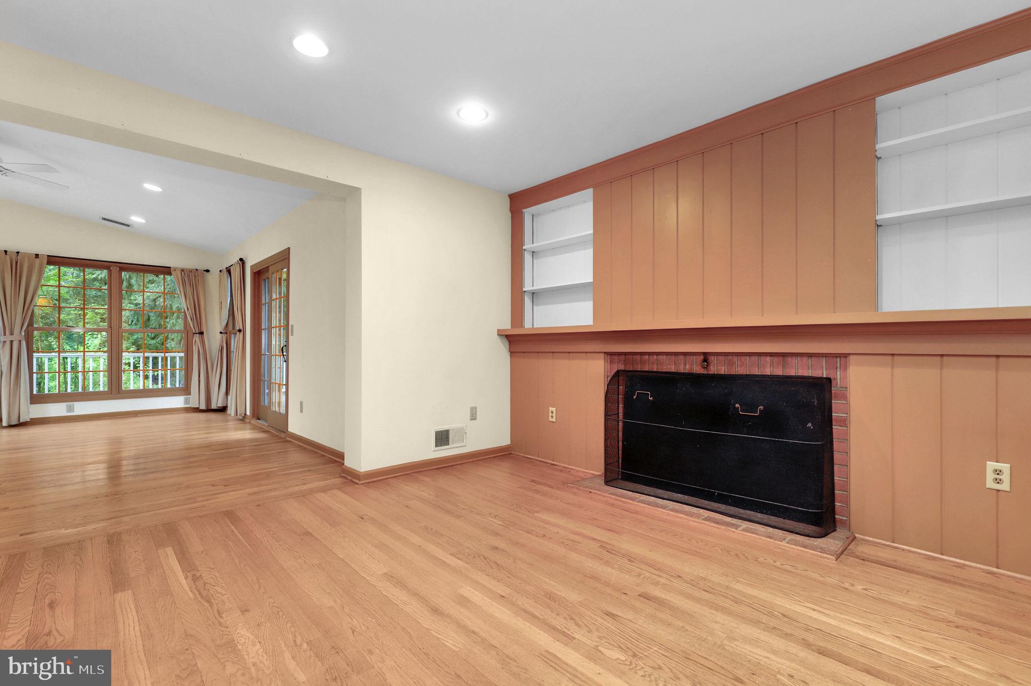 110 Linden Boulevard Middletown, MD 21769 - Photo 13 of 38 a view of an empty room with a fireplace and a window