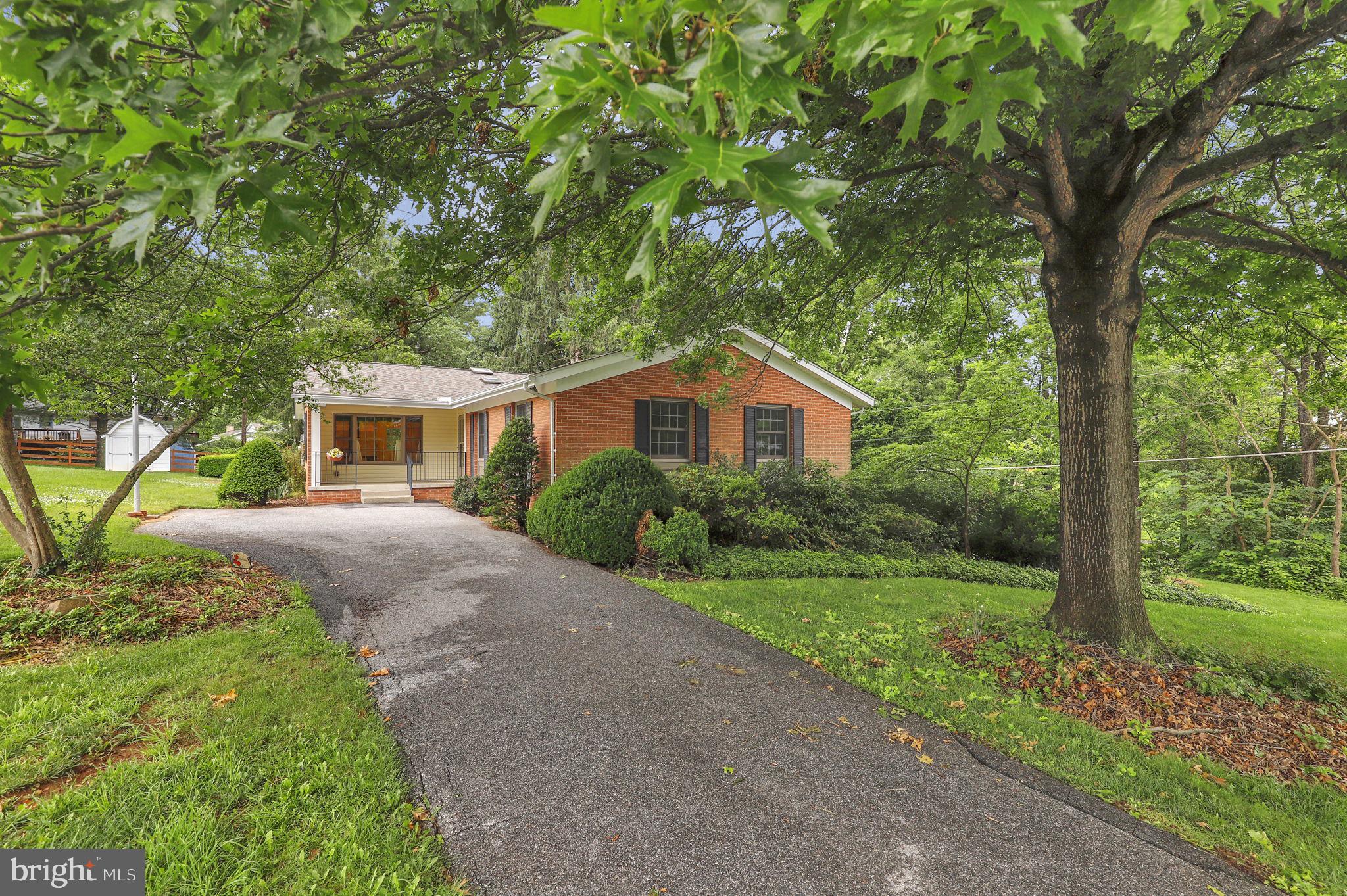 110 Linden Boulevard Middletown, MD 21769 - Photo 27 of 38 a yellow and red house with a tree in front of it