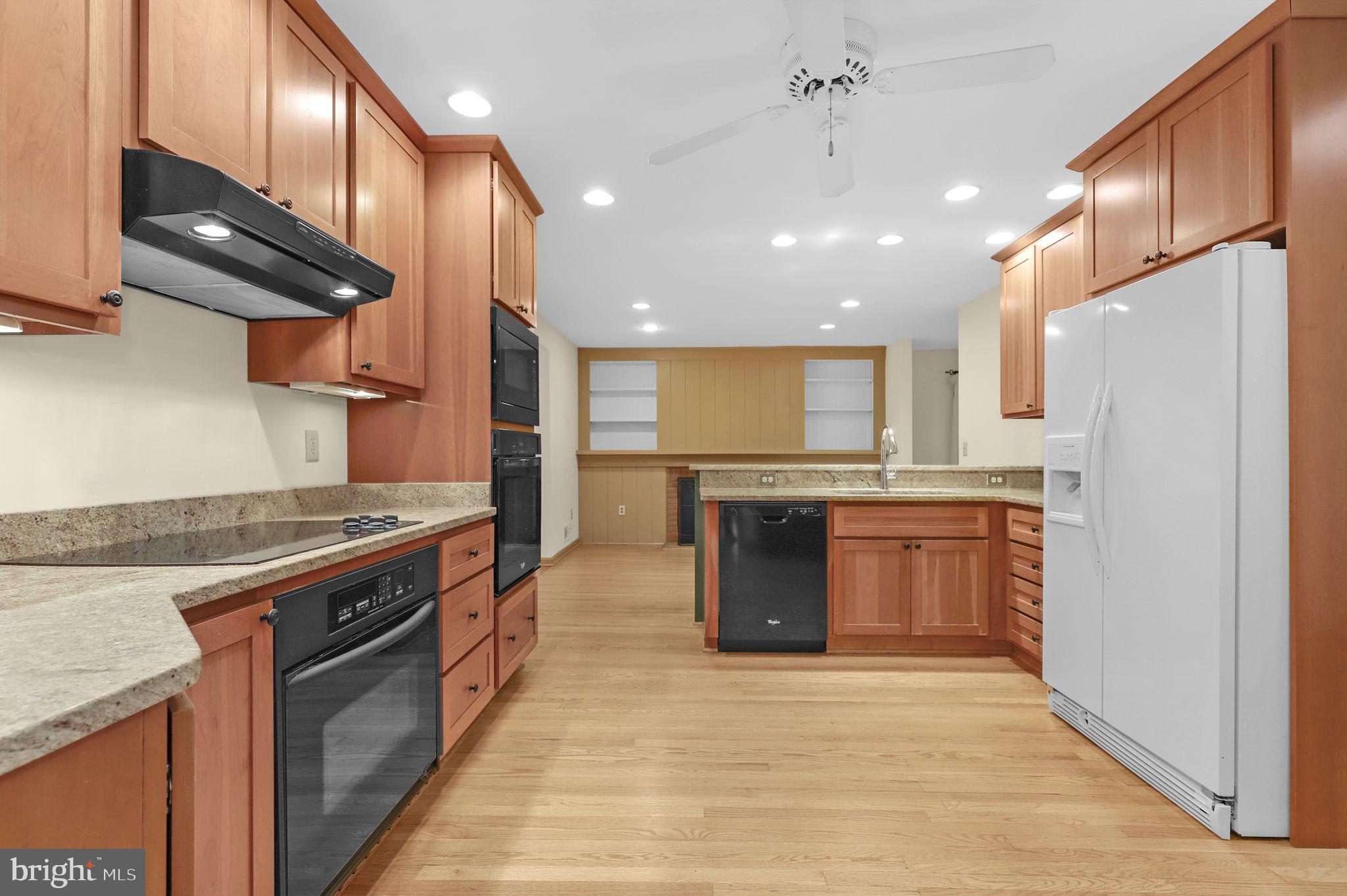 110 Linden Boulevard Middletown, MD 21769 - Photo 5 of 38 a kitchen with stainless steel appliances granite countertop a stove a sink and a refrigerator