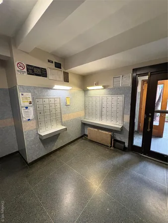 a view of an empty room with a fireplace