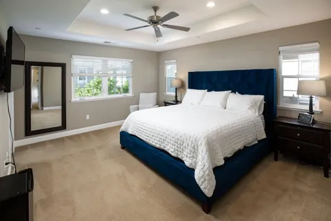 a bedroom with a large bed and a window