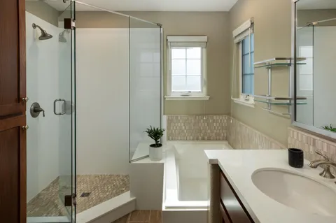 a bathroom with a tub and a sink
