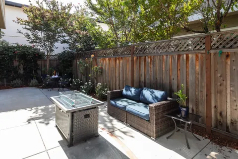 a view of backyard with furniture