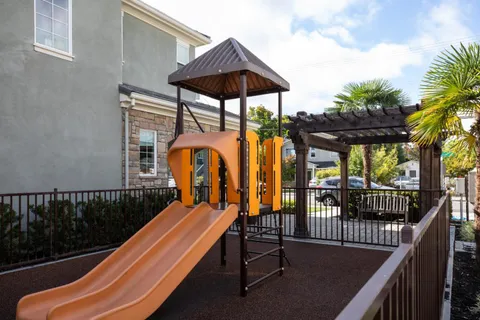 a view of balcony with furniture and garden