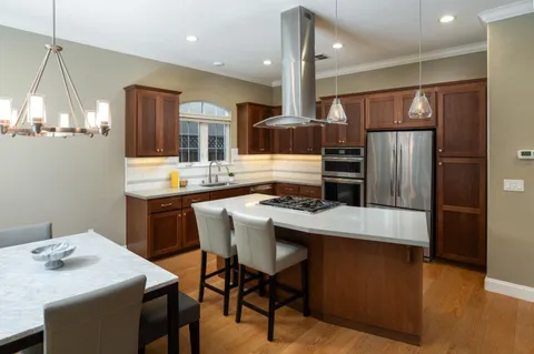a kitchen with a table and chairs in it