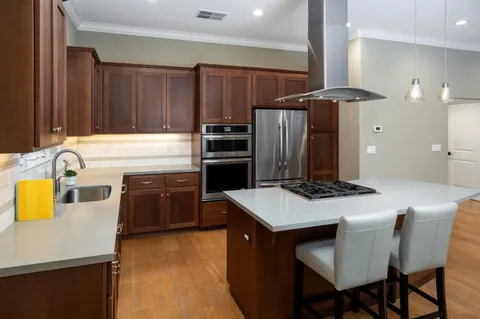 a kitchen with a stove a refrigerator and a stove