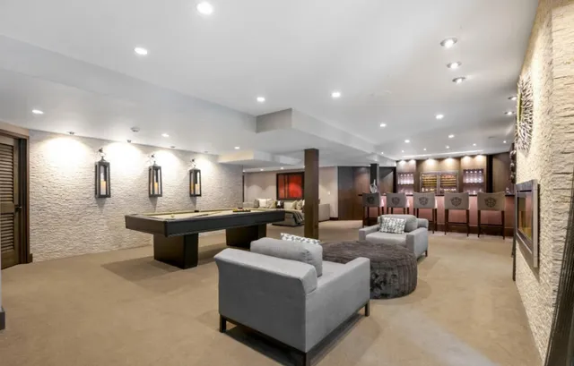 a living room with fireplace furniture and a flat screen tv