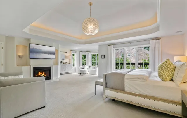 a bedroom with bed and a fireplace