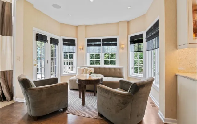 a living room with furniture and windows