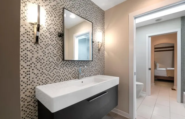 a bathroom with a sink a mirror and a shower