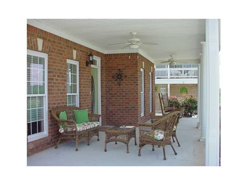 316 New Alcovy Road Social Circle, GA 30025 - Photo 1 of 1 Exterior Front. Rocking chair front porch overlooks community park