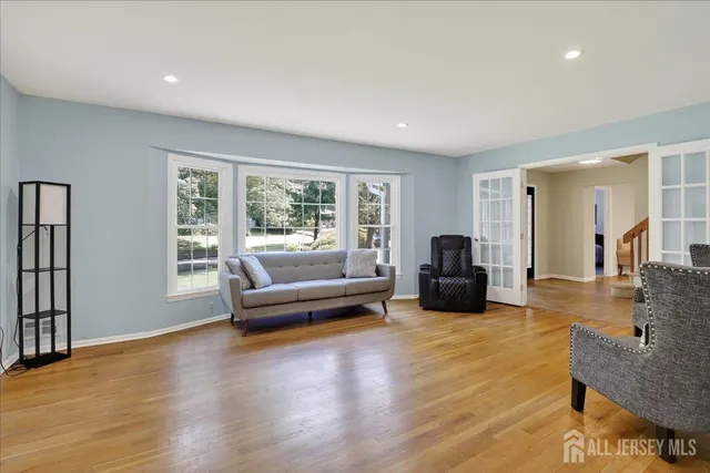 a view of a dining room with furniture window and wooden floor