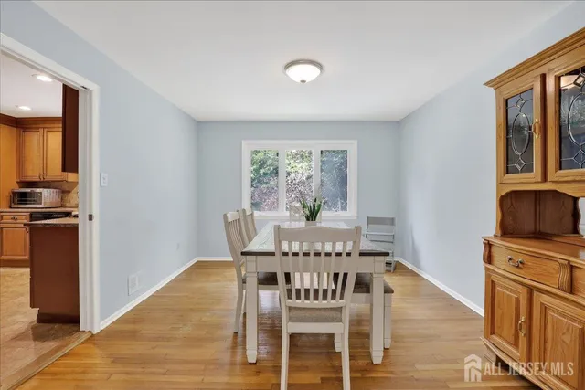 a living room with furniture and large windows
