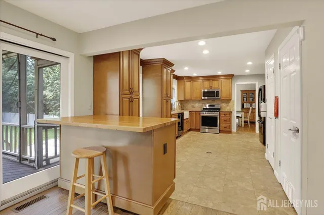 an aerial view of a house with pool outdoor seating and yard
