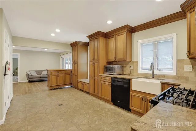 a utility room with sink dryer and washer