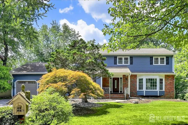 a bedroom with bed and a window