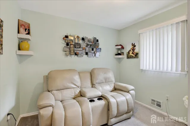 a view of a workspace with furniture