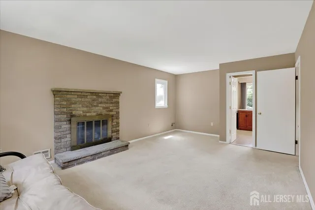 a living room with a flat screen tv and a fireplace