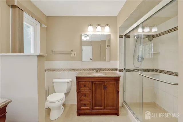 a dining room with furniture window and wooden floor