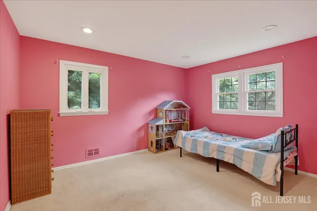 an aerial view of a house with backyard garden and outdoor seating