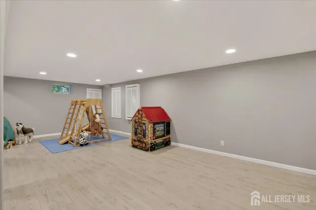 an aerial view of a house with outdoor space pool seating area and yard