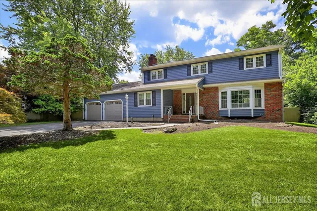a view of a house with a yard porch and sitting area