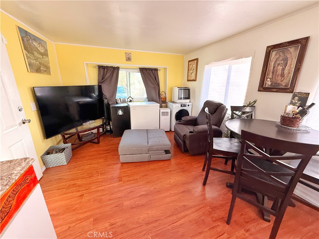 14925 Great Overland Stage Route, Unit A13 Julian, CA 92036 - Photo 13 of 19 a living room with furniture and a flat screen tv